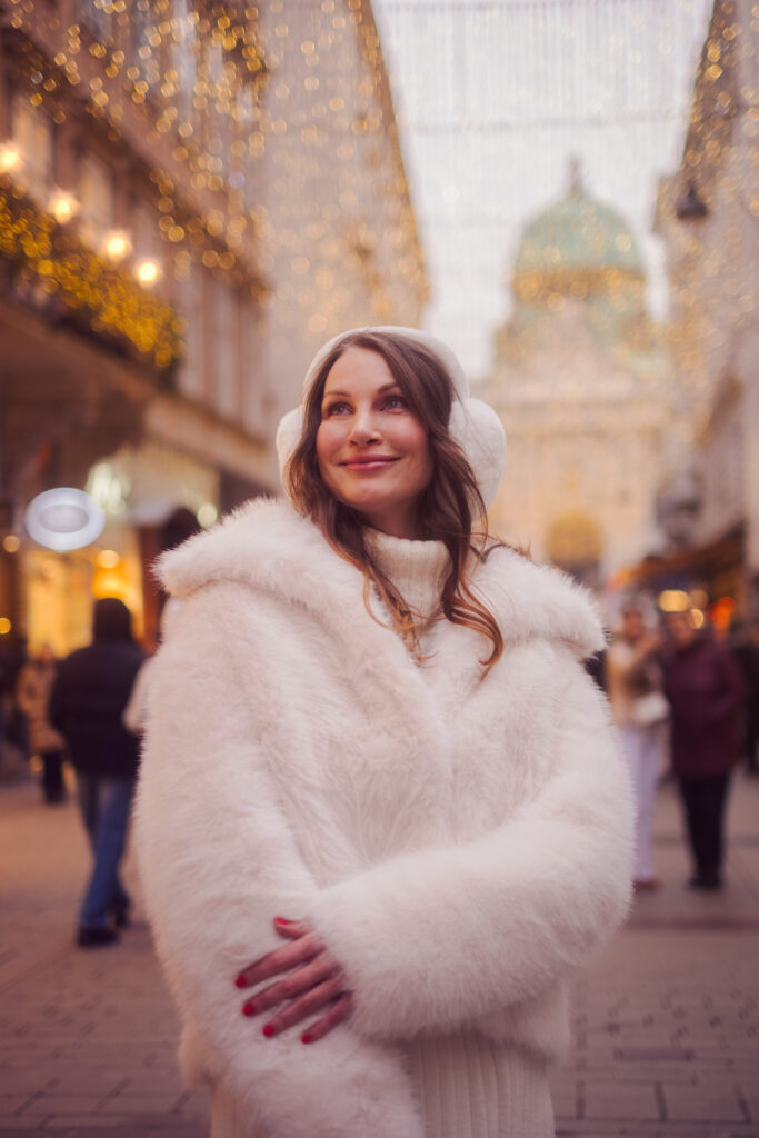 Winter Vienna photoshoot with elegant coat and city lights