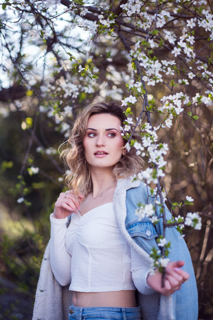 romantic portrait in vienna amidst white spring blossom